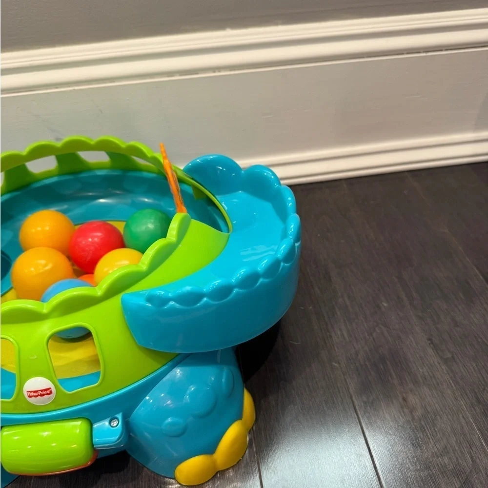 Fisher-Price Go Baby Go! Poppity Pop Musical Colorful Dinosaur Ball Toy Toddler